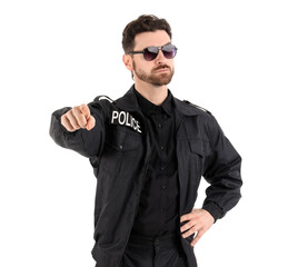 Male police officer pointing at viewer on white background
