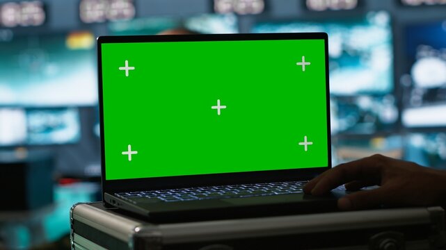 Army telecommunication systems operator using green screen gear, providing combat support. Military dispatcher managing communications networks with mockup laptop, camera A