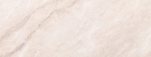 Texture light beige marble with brown lines pattern, macro background. Pastel cream stone backdrop