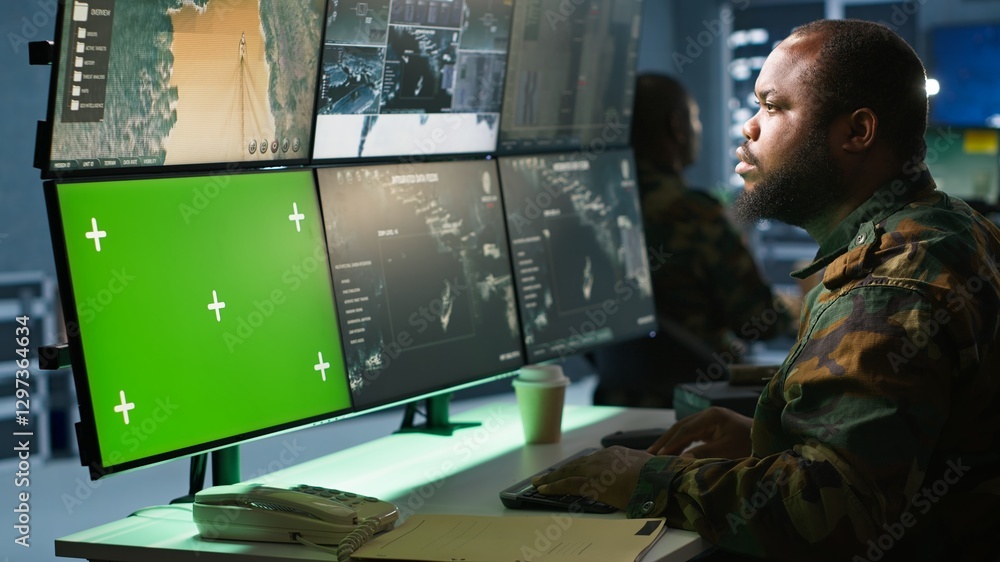 Poster military agent working in control room, using software on green screen devices, analyzing aerial rec