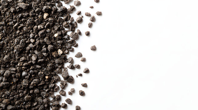 High-resolution close-up of black gravel scattered on a pristine white background