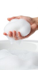 Fototapeta premium Luxurious Foam: A Handful of Creamy Lather in a White Basin