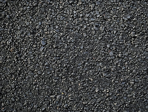 Closeup image of dark gray gravel texture.