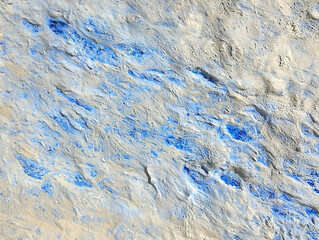 Abstract painting with blue and beige paint textures.