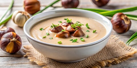 Close up of creamy chestnut soup with roasted chestnuts and chives garnish, flavorful, soup,  flavorful, soup, ingredients