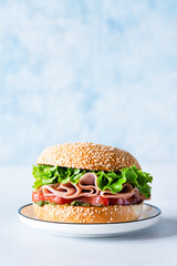 Sandwich with ham, tomato and greens