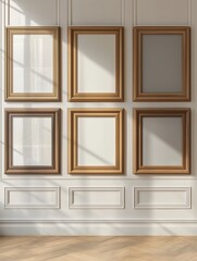 Sunlight illuminating six empty frames hanging on a classic white wall