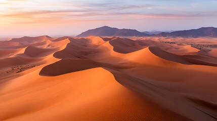 Naklejka premium Aerial view of a dramatic desert sunset nature's scenic beauty