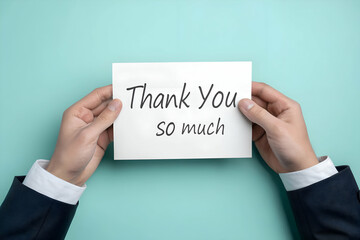 Hands holding a white card with thank you message in simple elegant style, expressing appreciation and gratitude