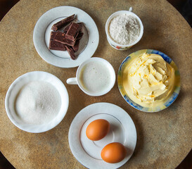 Ingredients for baking a delicious chocolate cake on table