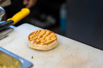 Preparing Bread For Cheeseburger