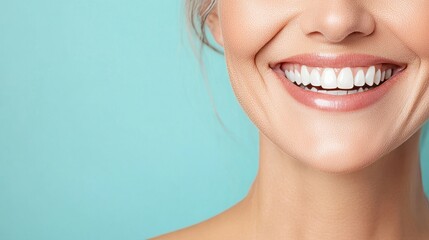 Obraz premium a close-up of a person's smiling mouth with perfect, white teeth.