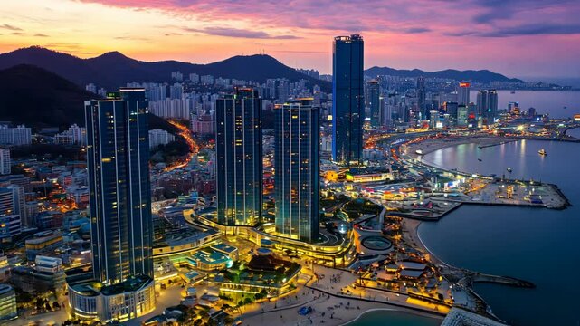 Skyline view of a bustling city with modern architecture and beautiful sunset reflections over the harbor