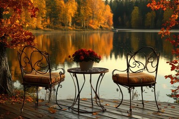 Fototapeta premium Serene lakeside scene with autumn foliage, cozy chairs, and a table adorned with flowers