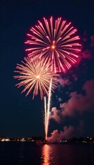 Aerial view of fireworks bursting into the sky with rapid firework bursts, light show, fireworks display
