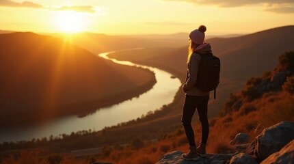 A Traveller Overlooking Tranquil River at Sunset Serenity.	