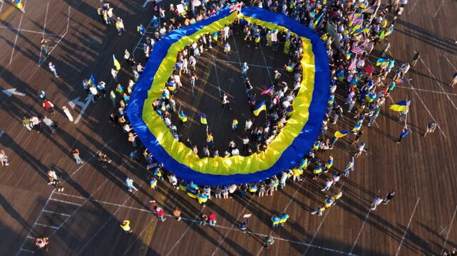Aerial Circular View of Ukrainian Flag Rally on Santa Monica Pier, Los Angeles, February 23, 2025