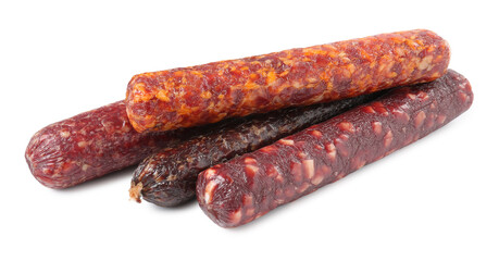 Many different dry cured sausages isolated on white