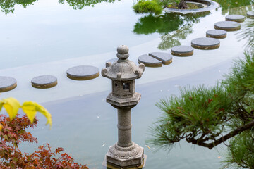 Stone lantern. Japanese garden, autumn. Garden lantern for Japanese garden is made of stone