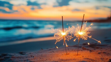 Two bright firework sparklers burning on the beach