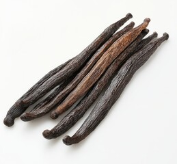 Assorted Natural Vanilla Beans on a White Surface Displaying Rich Colors and Textures Ideal for Culinary Uses and Aromatic Preparations