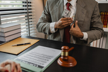 the lawyer is acting unethically and illegally because he is receiving bribes form his client's...