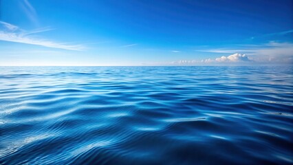 Fototapeta premium Calm ocean surface with gentle ripples in a clear blue water background, natural beauty, gentle ocean movement