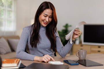 Tax deduction planning concept. Business asian woman calculating business balance prepare tax...