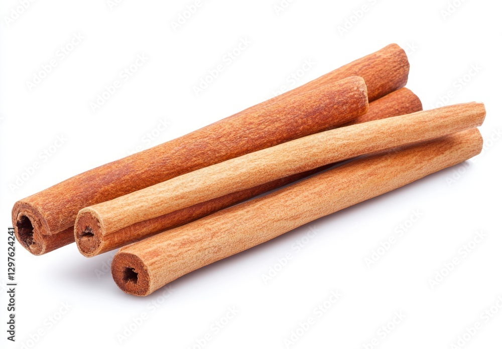 Poster close up view of several brown cinnamon sticks arranged on a white background. the sticks show textu