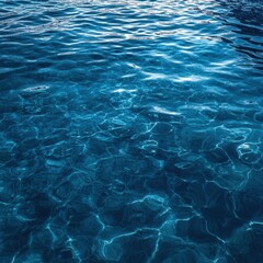 Tranquil turquoise water surface reflecting sunlight creating abstract patterns and a serene atmosphere ideal for backgrounds