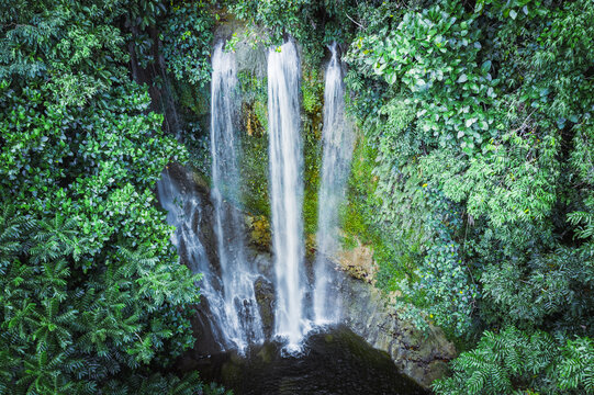 Tall triple waterfall in the green forest, Bohol island, Philippines