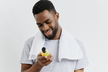 Man preparing for a refreshing cleanse with lemon juice and towel in hand