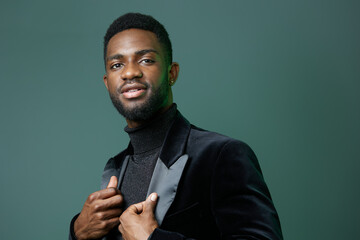 Stylish man in monochrome attire confidently posing, exuding elegance and sophistication in a chic urban setting