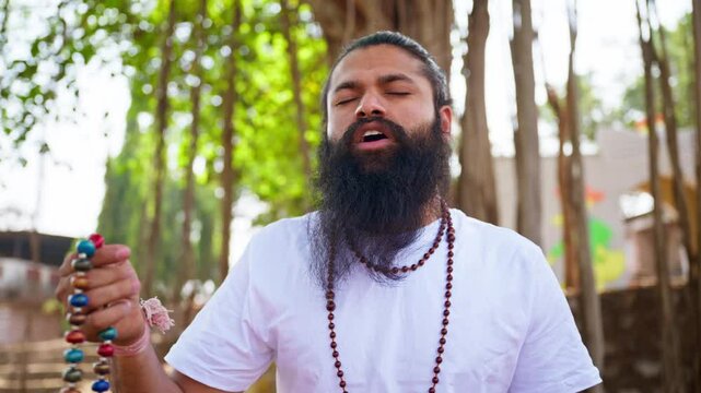Devotee practices deep meditation by park