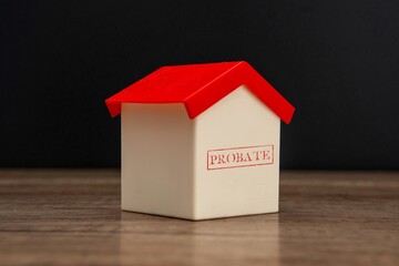 A small toy house with the word 
