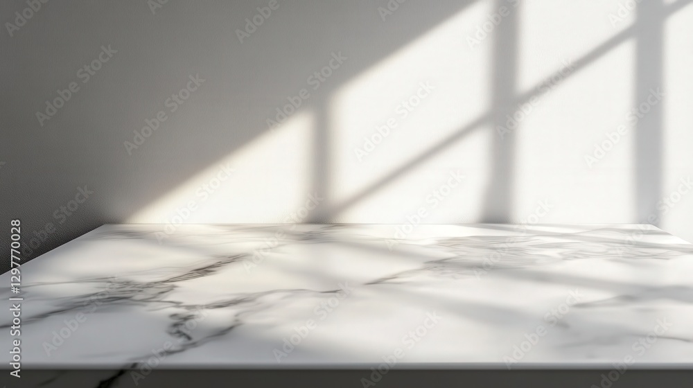 Poster marble tabletop with gentle gray streaks, reflecting soft ambient light, forming abstract shadow pat