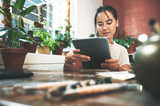 Woman, small business and tablet in workshop for pottery blog, social media post and inventory. Sculpture artist, order or female designer on app with online ratings, sales review and selling craft