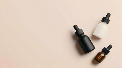 Overhead View Of Three Small Glass Bottles With Droppers Against A Neutral Beige Backdrop