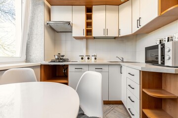 Modern Kitchen with White Cabinets and Gas Stove