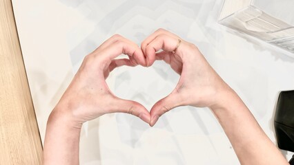 Fototapeta premium woman hands holding heart shape