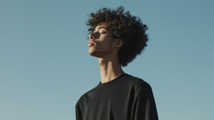 Obraz premium A model wearing a black shirt mockup, styled in a minimalist fashion