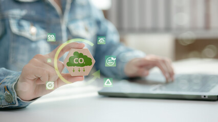A man exploring CO2 reduction techniques and sustainability initiatives using digital interface, aimed at environmental conservation