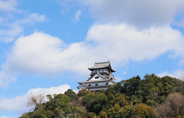 Inuyama Castle in Aichi Prefecture, Japan: A national treasure castle shining against the blue sky. February 11, 2025