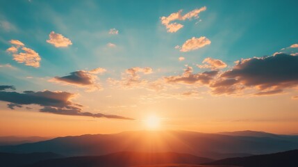Fototapeta premium Golden hour sunset over a mountain range.
