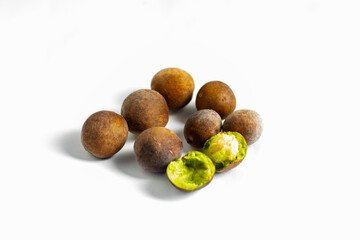 Bahera (Terminalia bellirica) is a medicinal fruit with a hard brown shell, astringent taste, rich in antioxidants, used in Ayurvedic medicine.