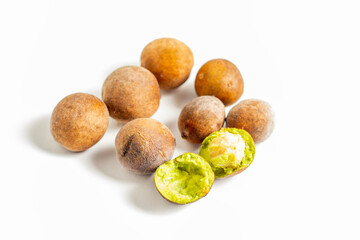 Bahera (Terminalia bellirica) is a medicinal fruit with a hard brown shell, astringent taste, rich in antioxidants, used in Ayurvedic medicine.