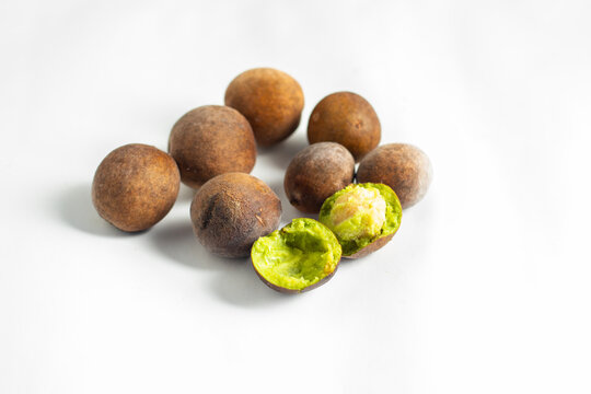 Bahera (Terminalia bellirica) is a medicinal fruit with a hard brown shell, astringent taste, rich in antioxidants, used in Ayurvedic medicine.