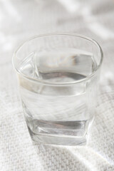 a drink in a glass on a white background, clean water