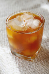 a drink in a glass on a white background, ice tea