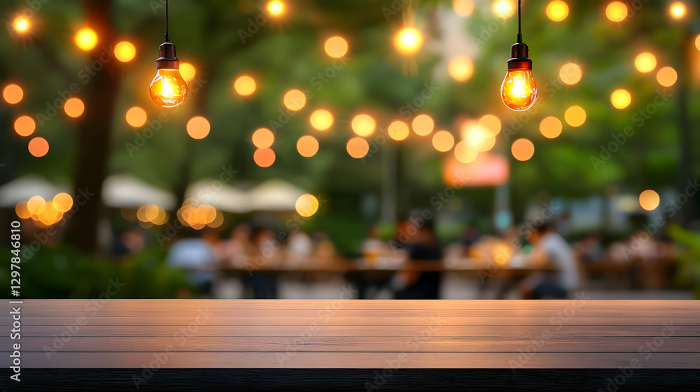 Poster blurred background of festive string lights and bokeh over wooden table during party